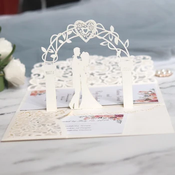 

(10 pieces/lot) 3D Pop Up Bride And Groom White Wedding Invitation Card Laser Cut Pocket Floral Engagement Invitations IC052