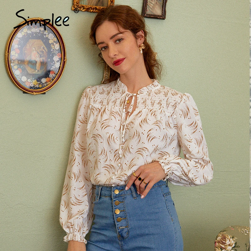 white blouse with ruffles in front