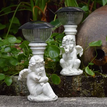 

Outdoor Garden Decoration Angel Boy Stroking The Bird By Sitting Next To The Roman Column Solar Lamps Home Art Resin Figurine