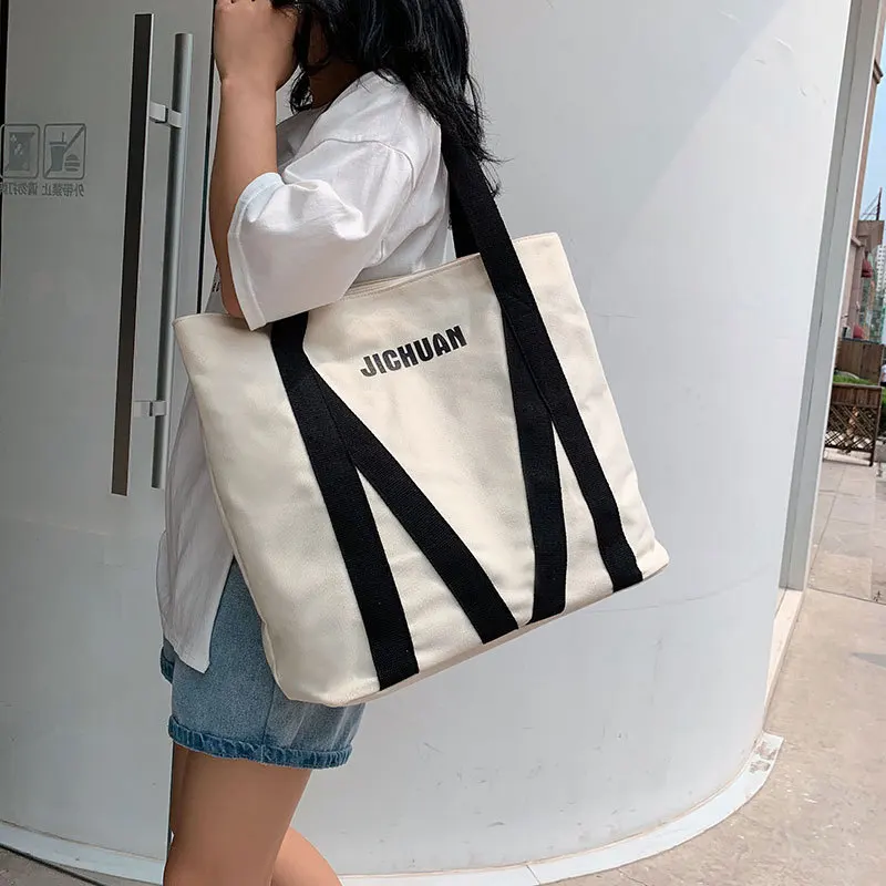 

Korean version of the new large-capacity canvas bag fashion hit color ladies art portable tote bag wild student shoulder bag