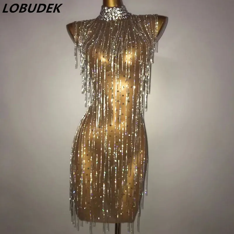 

Sexy Nude Mesh See Through Rhinestones Chain Mini Dress Women Sleeveless Diamond Tassel Bodycon Wrap Hips Clubwear Party Outfit