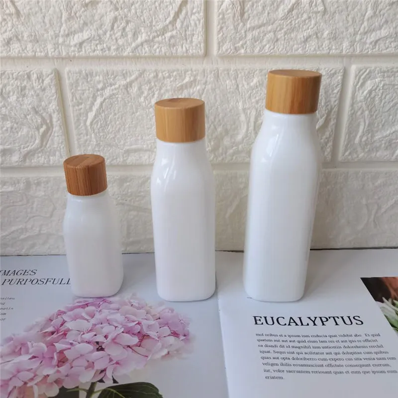 

Luxury Cosmetic Packaging Opal White Porcelain Glass Pump Spray Bottl 40ml 100ml 120ml with Bamboo Screw Cap
