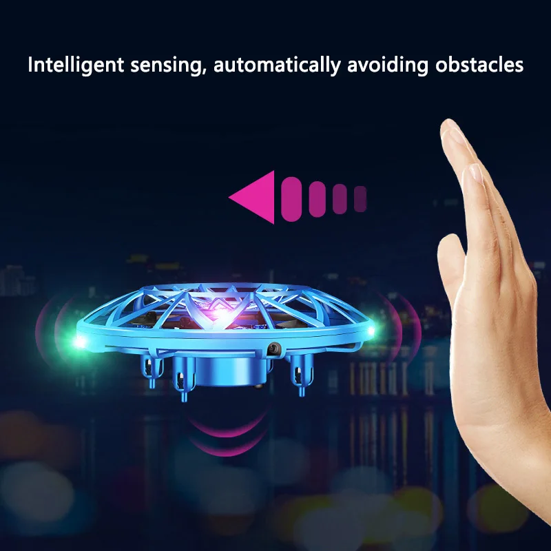 Gros plan sur le drone jouet enfant Landzo UFO infrarouge induction posé au sol, montrant ses capteurs infrarouges et son design futuriste.