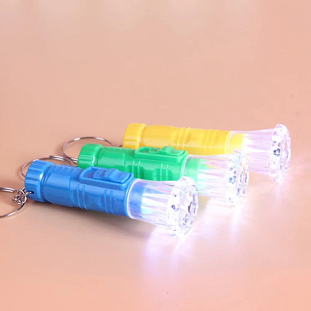 1PC Mini Plastic Hand Torch Portable Keyring Super Bright LED Flashlight Button Cell Powered Flash Light (Random Color)