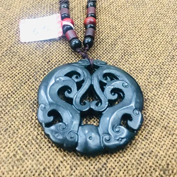 

Natural black stone Carved black openwork retro dragon pendant necklace Men and women sweater chain