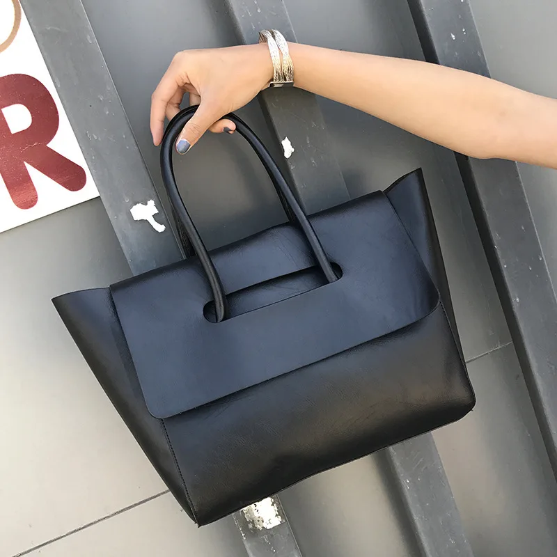 

2019 new high-quality European and American retro fashion hand bill of lading shoulder slung bag women handbag