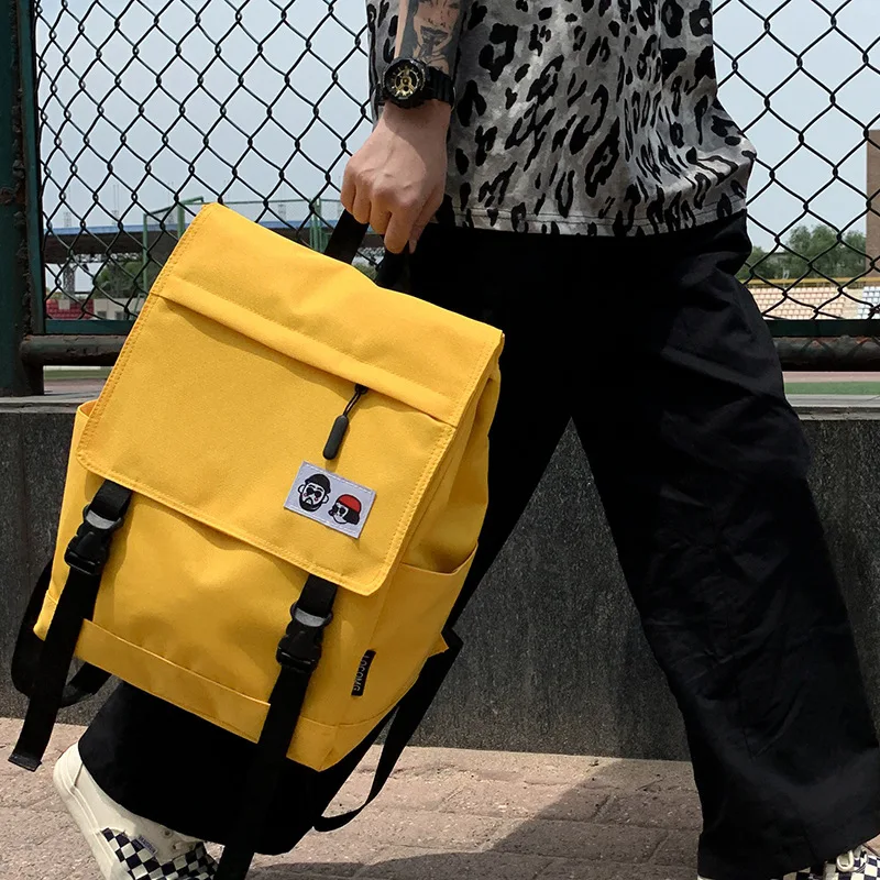 

The motorcycle cover art lovers student schoolbag is a simple canvas backpack