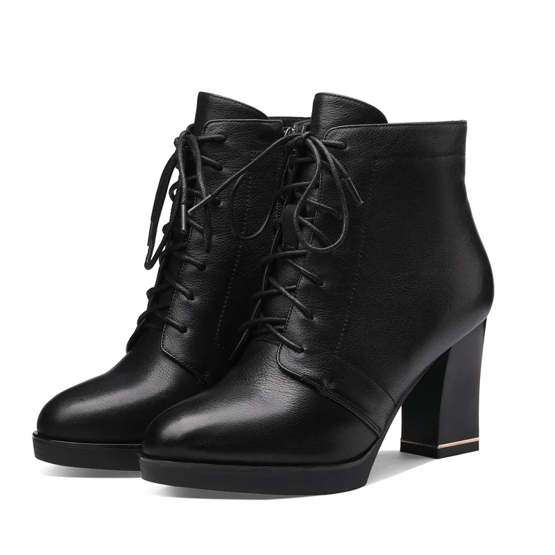 

leather women's boots have round heads and thick high heels. The metal zipper waterproof platform is a short boots for women.