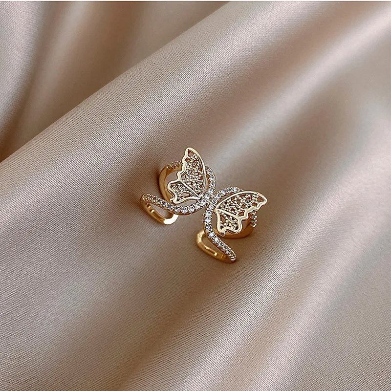 

The new butterfly hollow opening ring copper inlaid zircon real gold electroplating female niche design jewelry