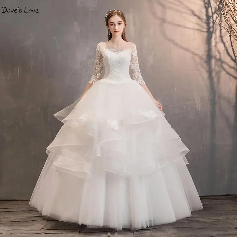 

Beige Wedding Dresses 2020 Stock Lace Appliques Tulle Tiered Ruffles Ball Gown Three Quarter Sleeves Long Garden Bride Gown