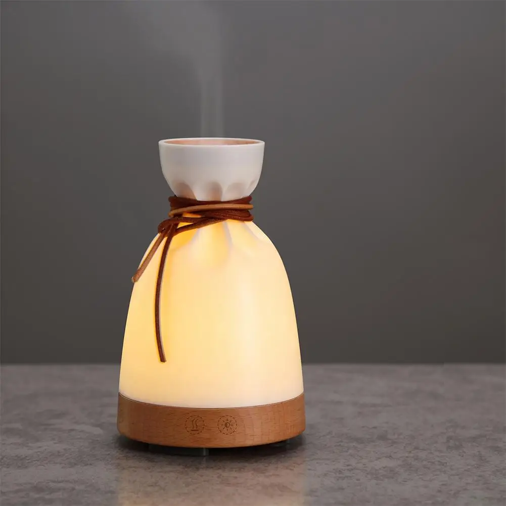 

LumiParty 140ML Fashion Creative Cloth Bag Shape Noiseless Humidifier Aroma Diffuser with LED Night Light Warm White Light