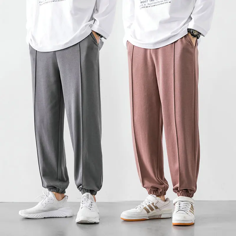 

Men's casual pants 2020 autumn and winter new Korean style loose wild nine-point guard pants young people fashion trend clothing