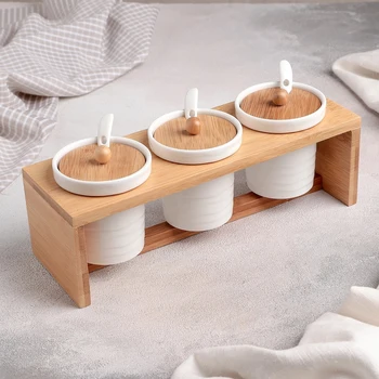 

Set of cans for bulk products "Estet", 150 ml, 3 PCs, with spoons, on a wooden stand