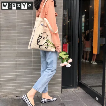 

Korea Ins simple female avatar printed canvas bag shoulder bag wild outer pocket literary casual tote for women