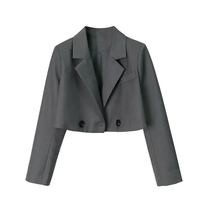 Stylish woman wearing a notched Korean-style cropped blazer in bold colors long leaves