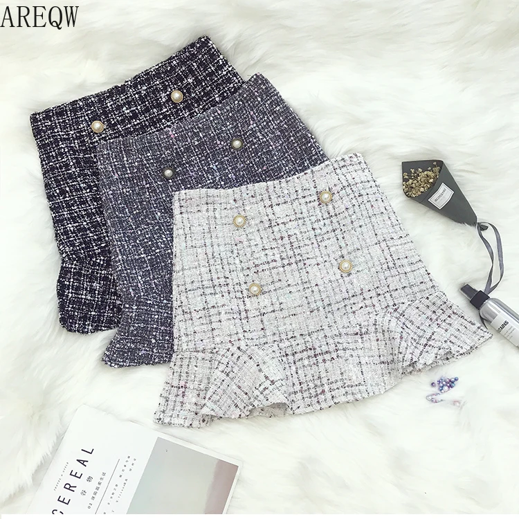 Comprar Nueva falda Coreana de Tweed de cintura alta con botón de lana de media longitud falda negra Otoño Invierno 2019