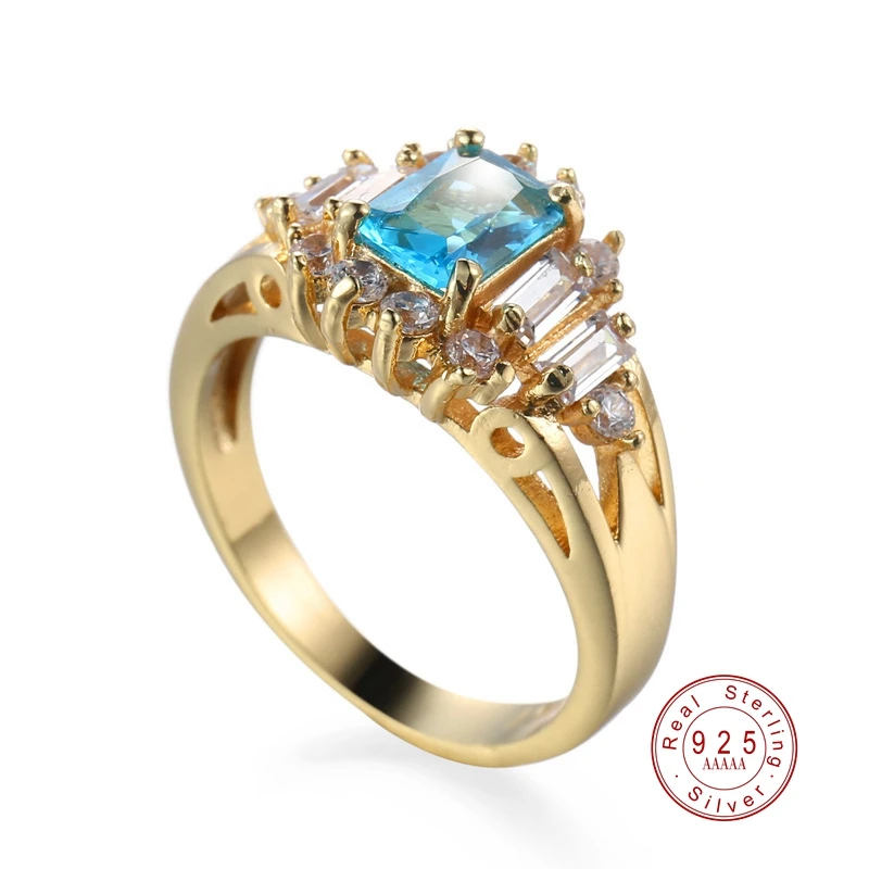 Женское большое кольцо с фианитом золотого цвета крупным синим цирконием для