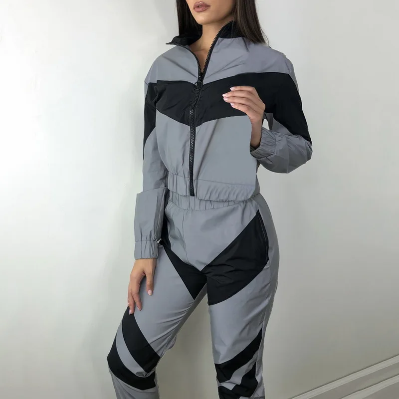 

2020 Women Reflective Splicing Long Sleeve Zipper up Trench Top Pants 2 Piece Outfits Night Version Tracksuit Set Streetwear