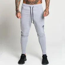 Повседневные облегающие брюки мужские хлопковые спортивные Jogger спортивные штаны тренажерные залы Фитнес упражнения для брюк Осенняя мужская спортивная одежда Брендовые спортивные брюки