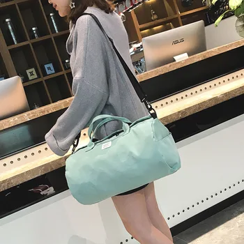 

Travel bag fashion sports canvas cylinder fitness bag solid color simple shoulder cylindrical hand luggage bag overnight bag
