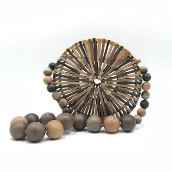 

Bamboo woven hand-held makeup bag round hollowed-out handbag street shot beach ins super hot 2020 Europe and the United States