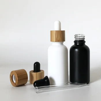 

CBD Recycled eco friendly Round Natural Bamboo Wooden Lid Beard oil Frosted Black Glass Dropper Bottle with Caps 1oz 50ml100ml