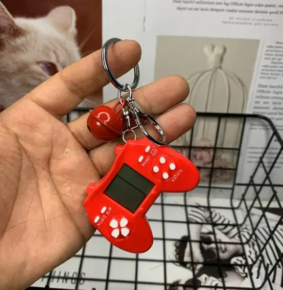 Retro Console Game Keychain Built-In 7 Games Puzzle Video Game Mini Handheld Game Console Pendant New Year Xmas Gift For Kids 