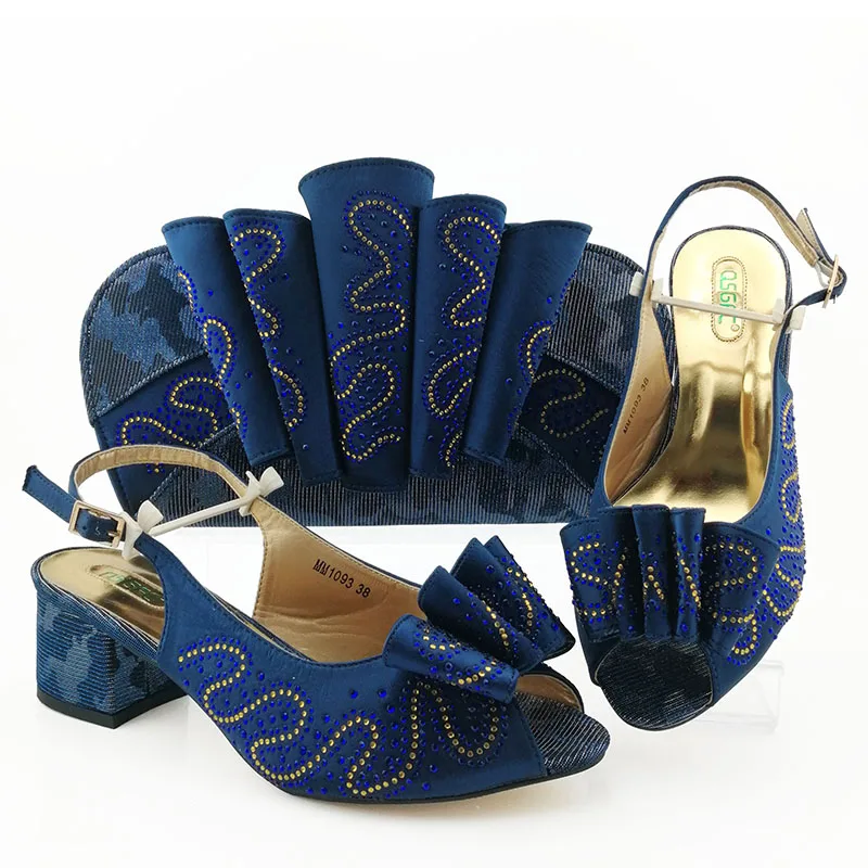 Shoes matching bag set in navy blue to 