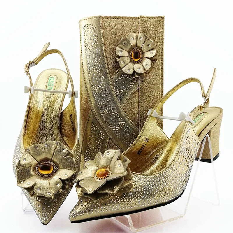 gold sandals and matching bag