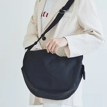 

Korean version of the simple fashion large-capacity shoulder canvas bag casual solid color messenger dumpling bag