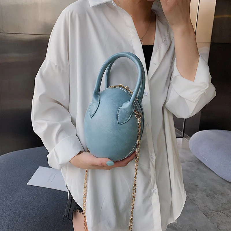 

New small bag 2019 new solid color egg hand-held leisure small round bag tide single shoulder oblique chain bag
