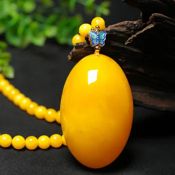 

Beeswax pendant chanterelle yellow old beeswax drop shape amber rough stone sweater chain necklace pendant men and women