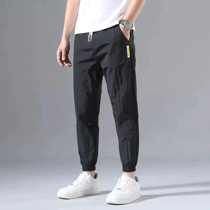 

Ice Silk Pants Men's Summer Thin Section Trend Wild Loose Casual Pants Sports Pants Quick-drying Harlan Nine-point Pants 5XL