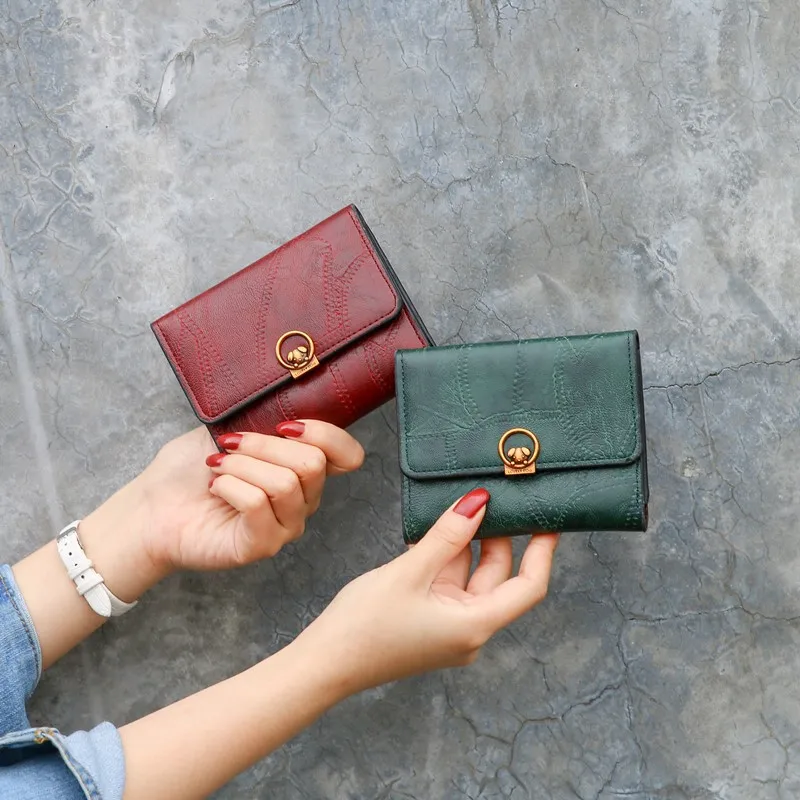 

2020 new Korean version of small wallet women short European and American ins retro simple buckle card wallet coin purse