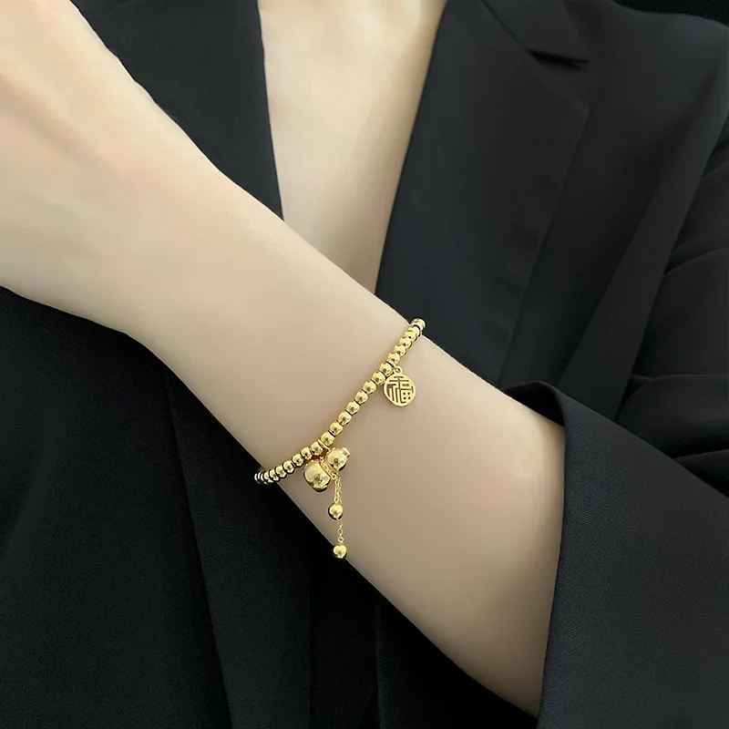 

New simple small gourd blessing titanium steel round bead elastic rope bracelet female fashion color-fast retractable hand jewel