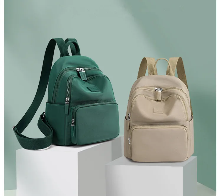 Stylish waterproof women's backpack in a compact design, ideal for college, travel, or daily use, with multiple compartments and adjustable straps. green beige