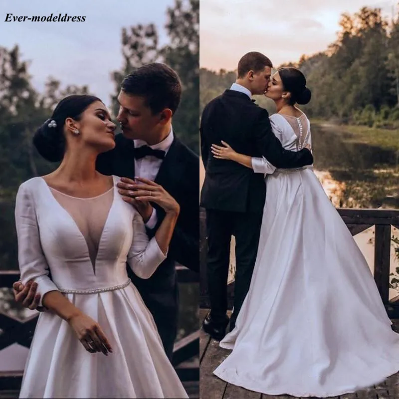 

Elegant 2020 Wedding Dresses Sheer Scoop 3/4 Sleeves Illusion Buttons Back Pearl Beaded Country Bridal Gowns Vestido Novia