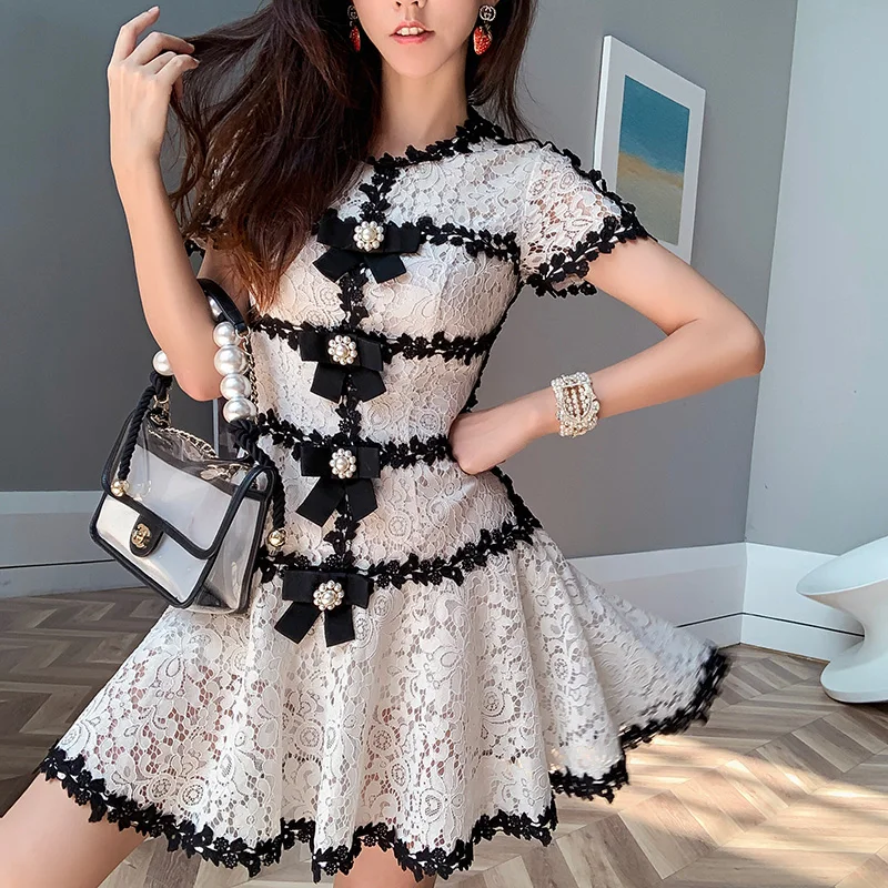 

Contrast Black/White Guipure Eyelet Lace Tiered Dress Peal Button Embellished Dress Knotbow Jacquard Cotton Brocade Skater Dress