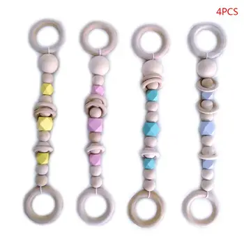 

Drop Ship 4 Pcs/set Nordic Wooden Training Gripper Hanging String Children Room Decoration Toy Baby Fitness Rack Pacifier Chain