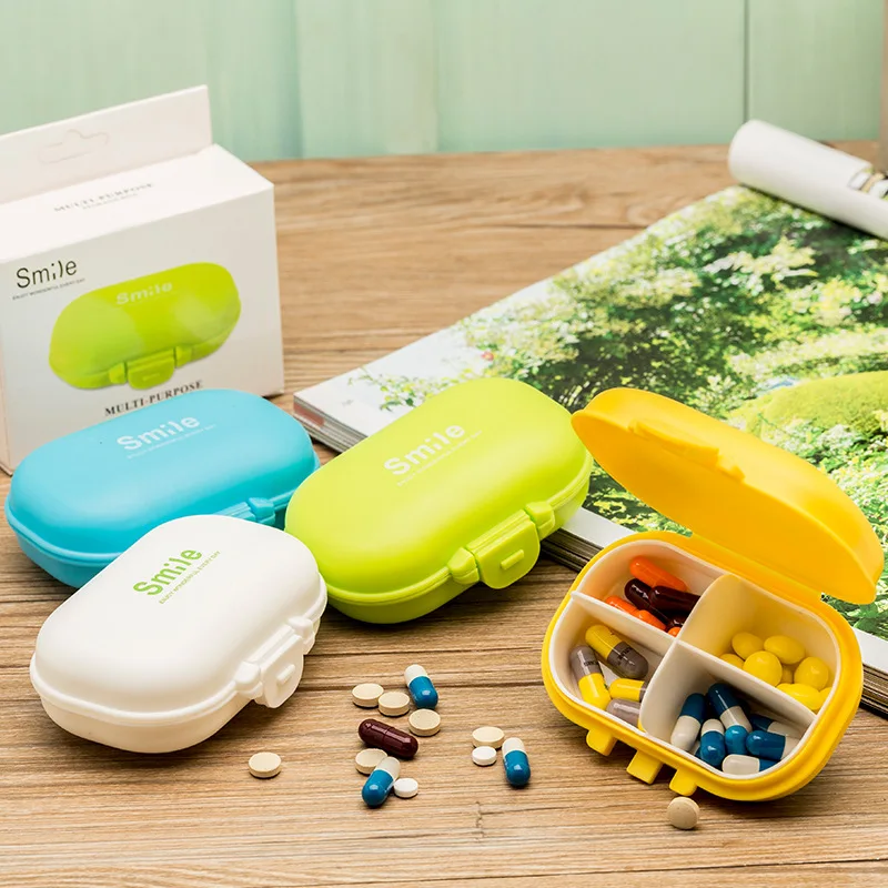 

Small pill box travel portable 4 grid pill box plastic storage box jewelry box a week creative new product explosion