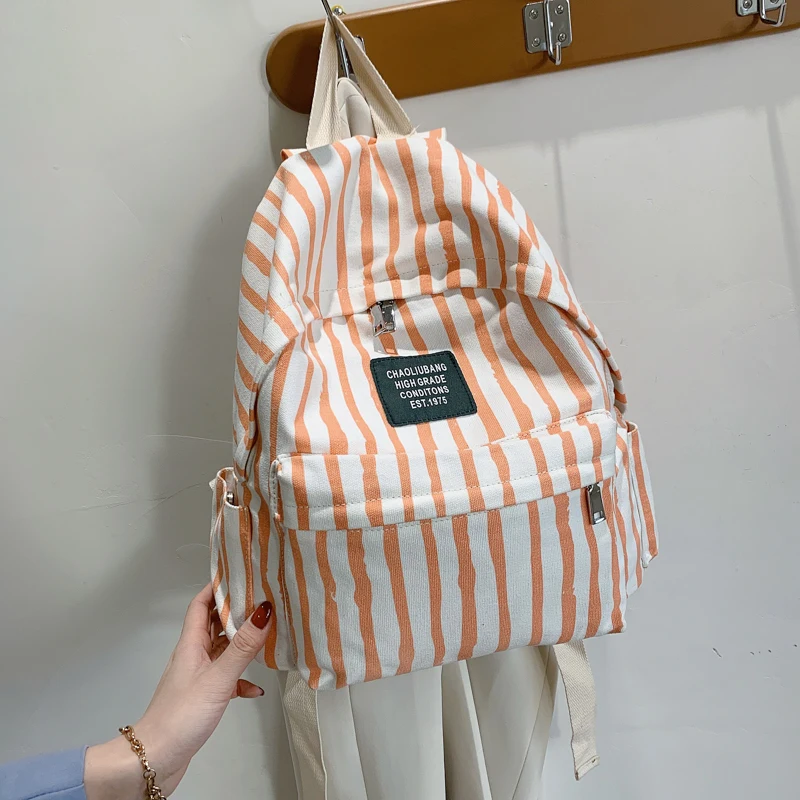 cool backpacks accessories	 Stripe Print Casual Lady Canvas Backpack New Listing Large Capacity Simple Student Backpack Fashion Wild Travel Hand Bag most stylish backpacks