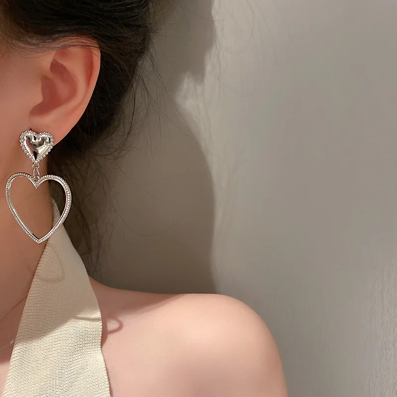 

Starmoon Simple Design Silver Color Hollow Heart Drop Earrings For Women New Brand Fashion Ear Cuff Piercing Dangle Earring Gift