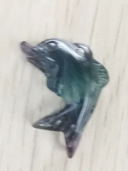 

Hand-carved fish in natural colored gemstone with polished crystal healing
