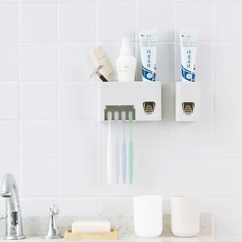 

Toothbrush holder in bathroom adhesive toothpaste holder wall hanging automatic toothpaste extruder toothbrush holder