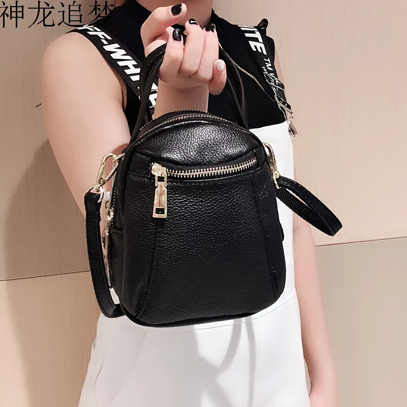 

USB hole first layer cowhide leather mini mobile phone bag women backpack multi-layer wild shoulder bag double back leisure bag