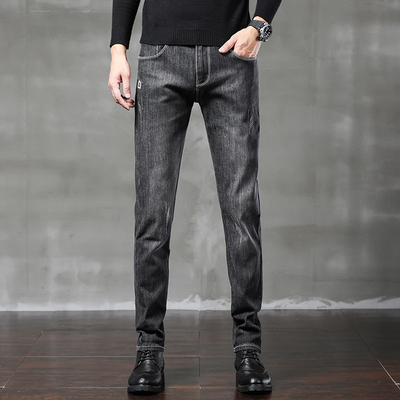 

2020 autumn and winter new men's casual jeans Korean version of slim feet stretch trousers
