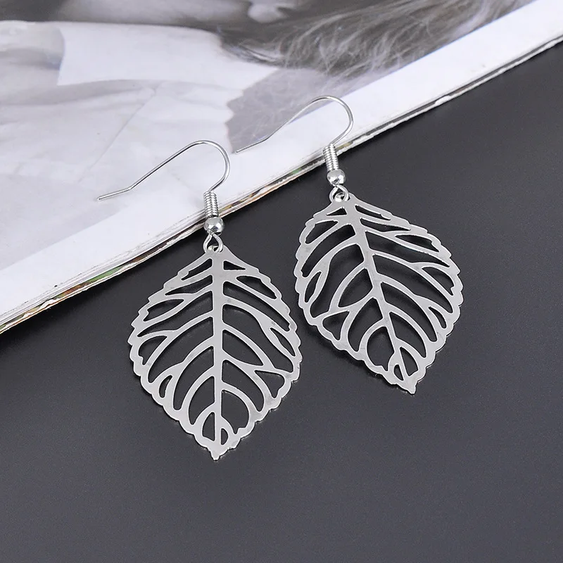 HIYONG Pendientes Mujer Горячая Мода оптом полые металлические листья Висячие длинное