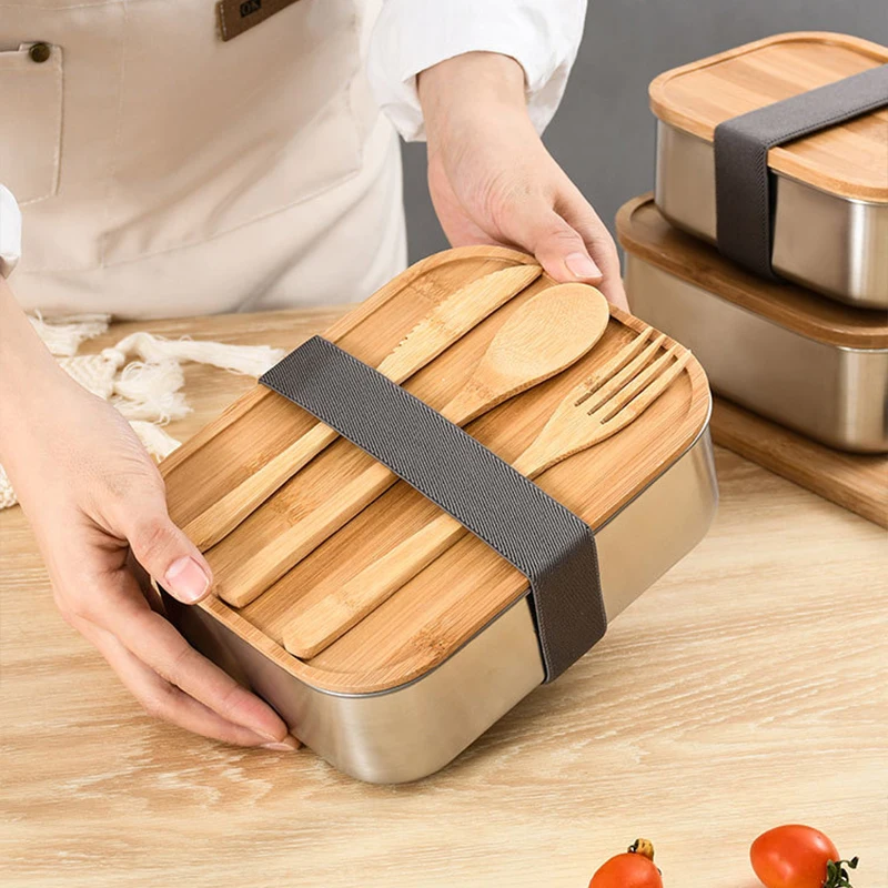 Stylish stainless steel bento box with wooden cover: perfect for lunches on the go