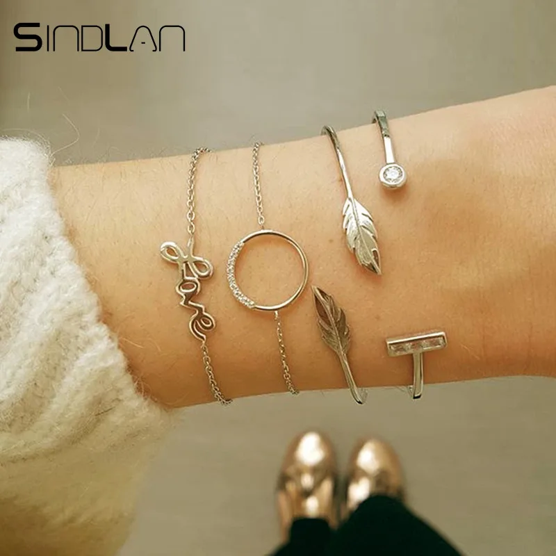

Sindlan 4PCs Gold Feather LOVE Letter Bangles for Women Geometric Crystal Charm Boho Open Bracelets Set Fashion Wrist Jewelry
