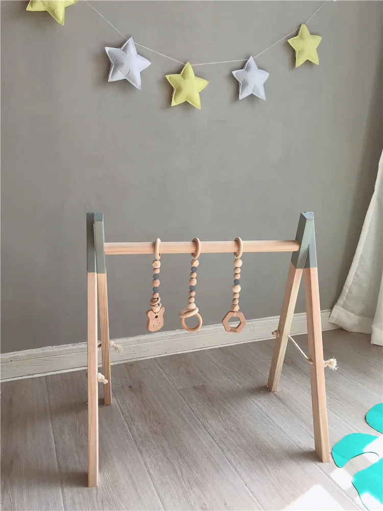 

Nordic Wooden Baby Gym with three Rattles Play Nursery Wooden Toy Activity Frame